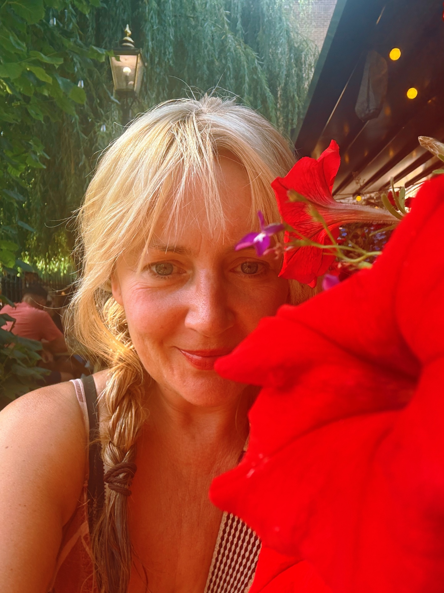 Zoe Russell-Turner, co-founder of Creative Journey Retreats, among tropical flowers